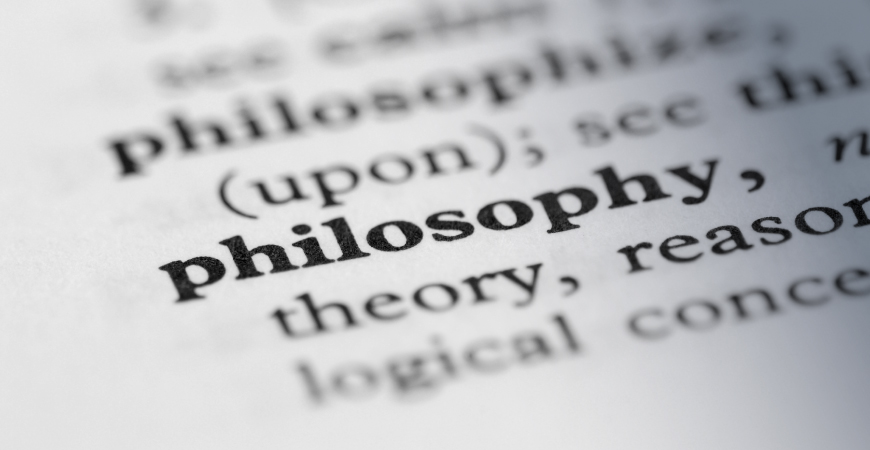 Close up of the word “philosophy” in a dictionary.